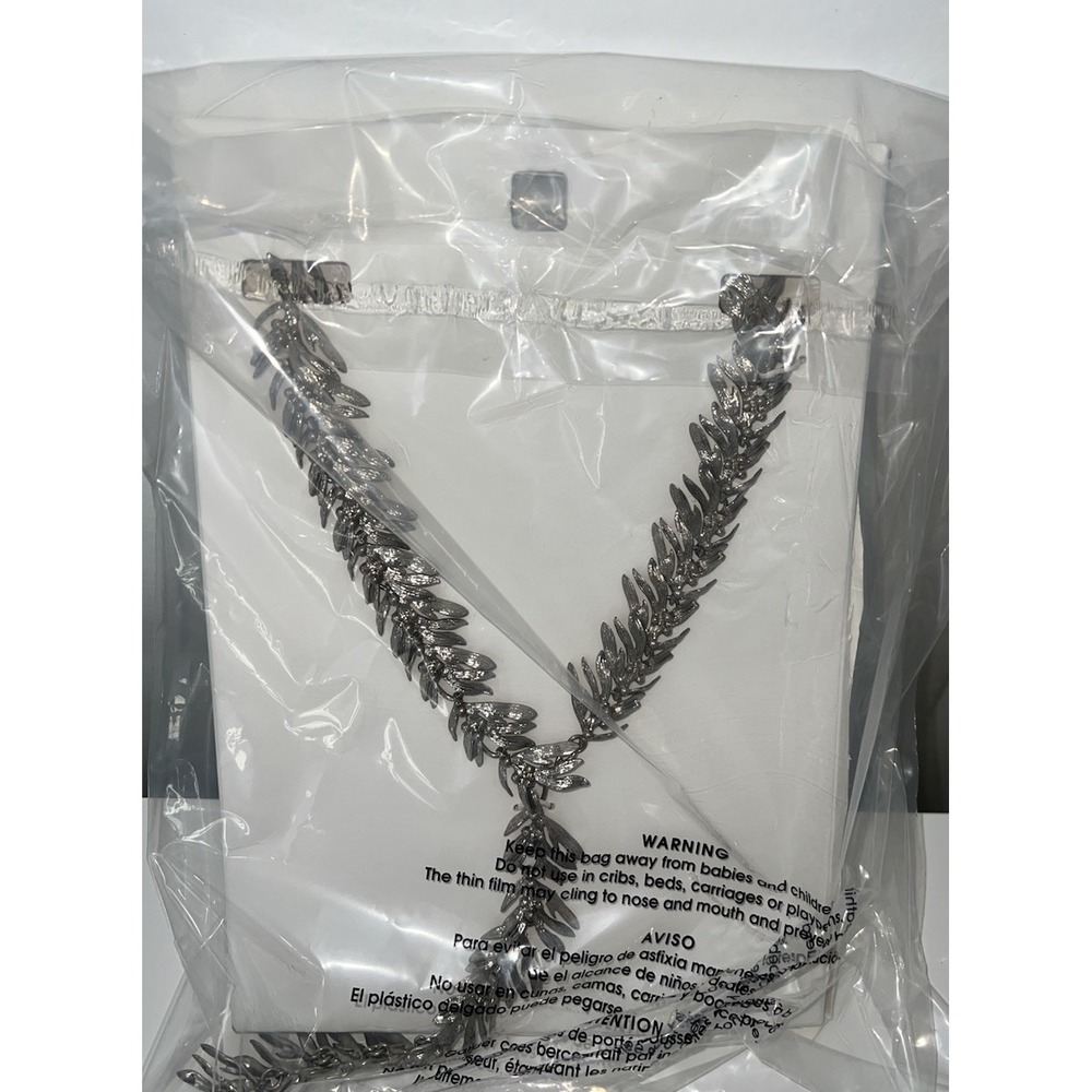 silver-toned metal leaf long necklace from Zara